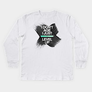 I don’t age I just level up Kids Long Sleeve T-Shirt